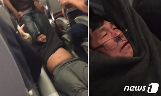 9일(현지시간) 유나이티드 항공 3411편에서 승객이 승무원에 의해 강제로 끌려가고 있다./사진=뉴스1